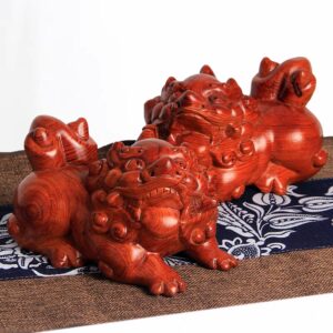 A pair of mahogany Pixiu ornaments